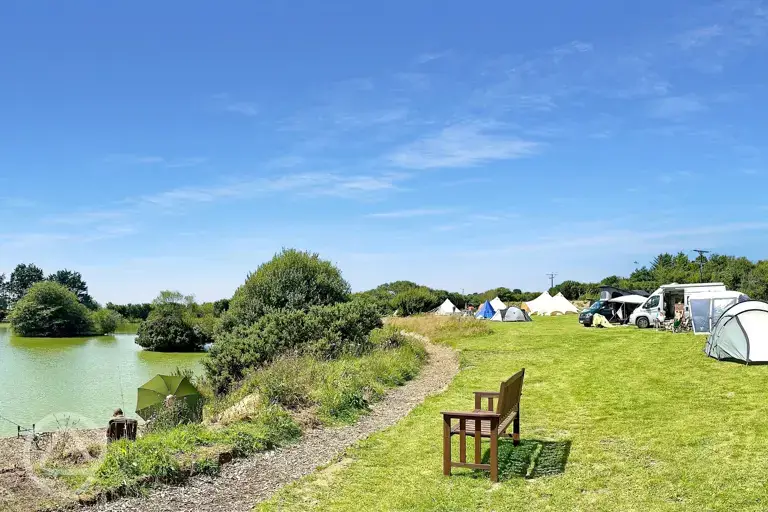 Non electric grass pitches by the lake 