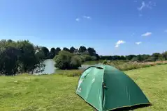 Non electric grass pitches by the lake 