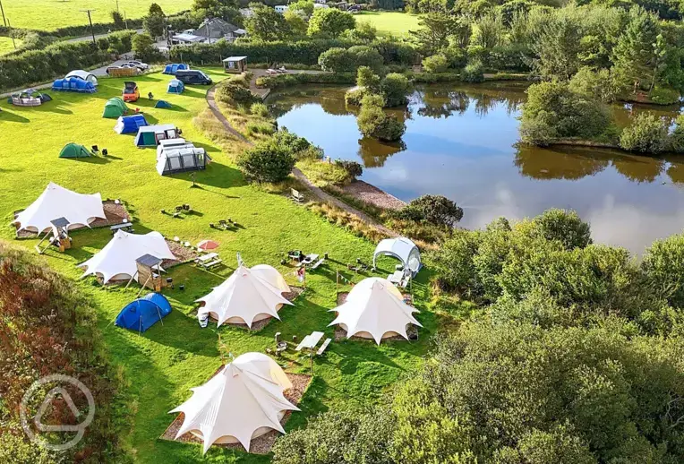 Bell tents and camping pitches by the lake edge