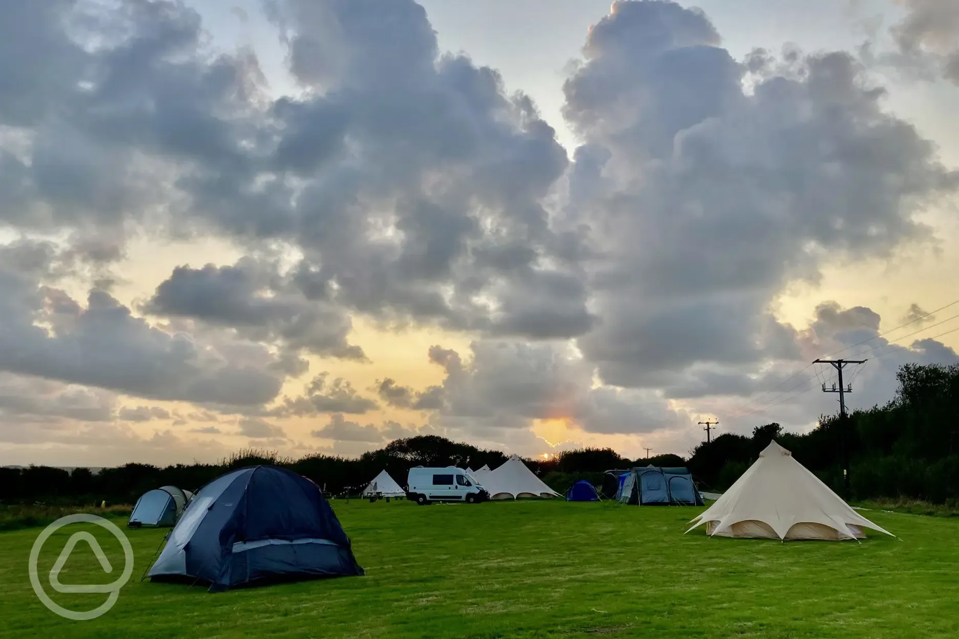 Camping field at sunset