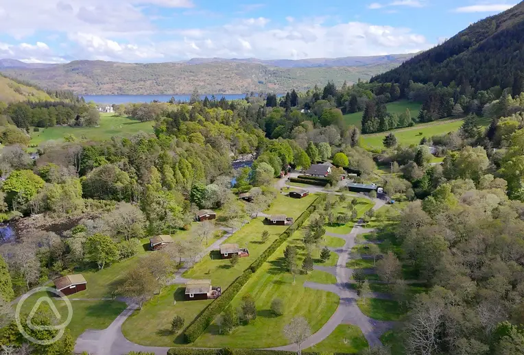 Aerial of Forest Glen Holiday Park towards Loch Ness and mountain views