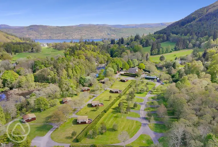 Aerial of Forest Glen Holiday Park towards Loch Ness and mountain views