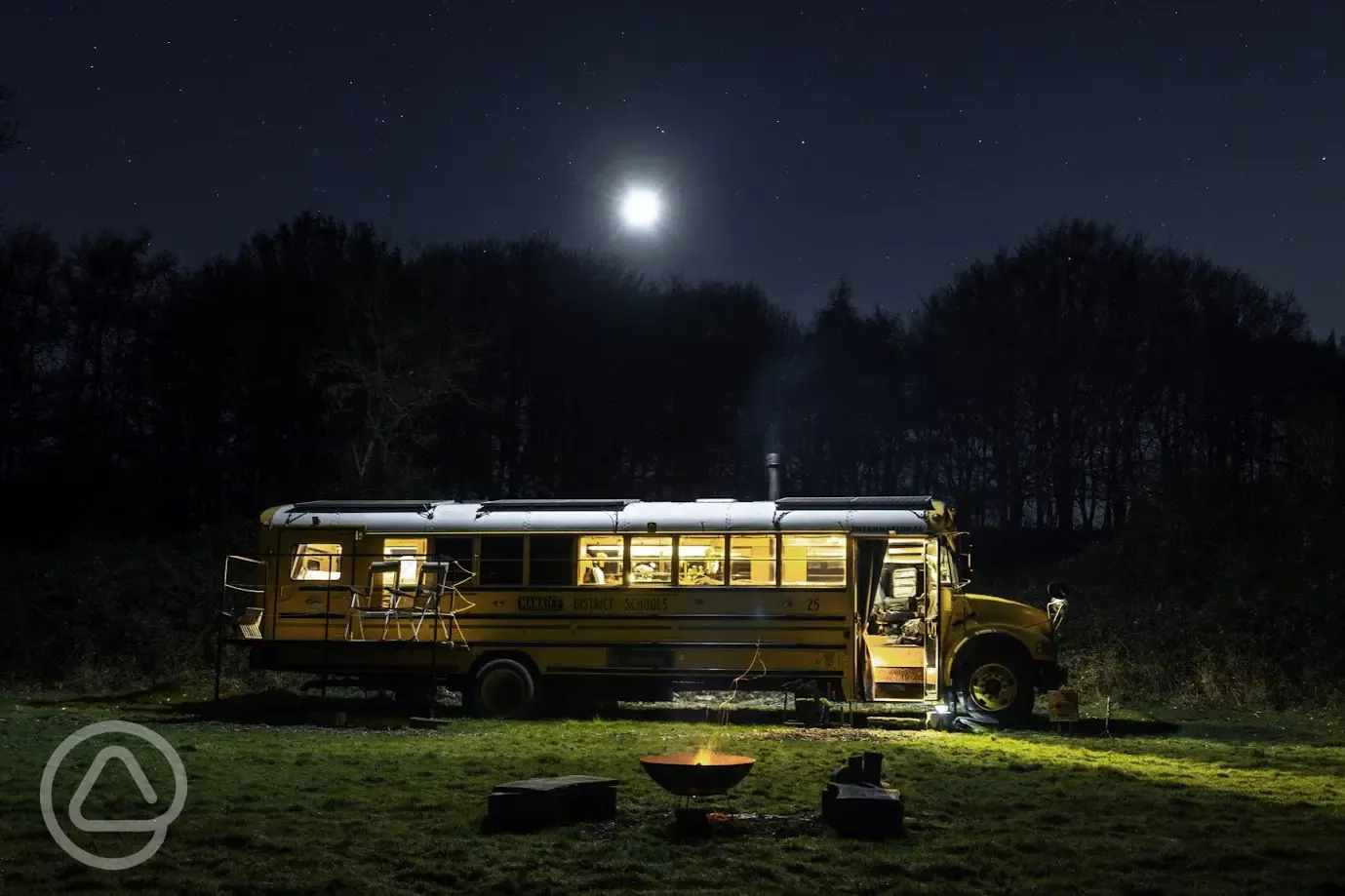 Glamping school bus at night