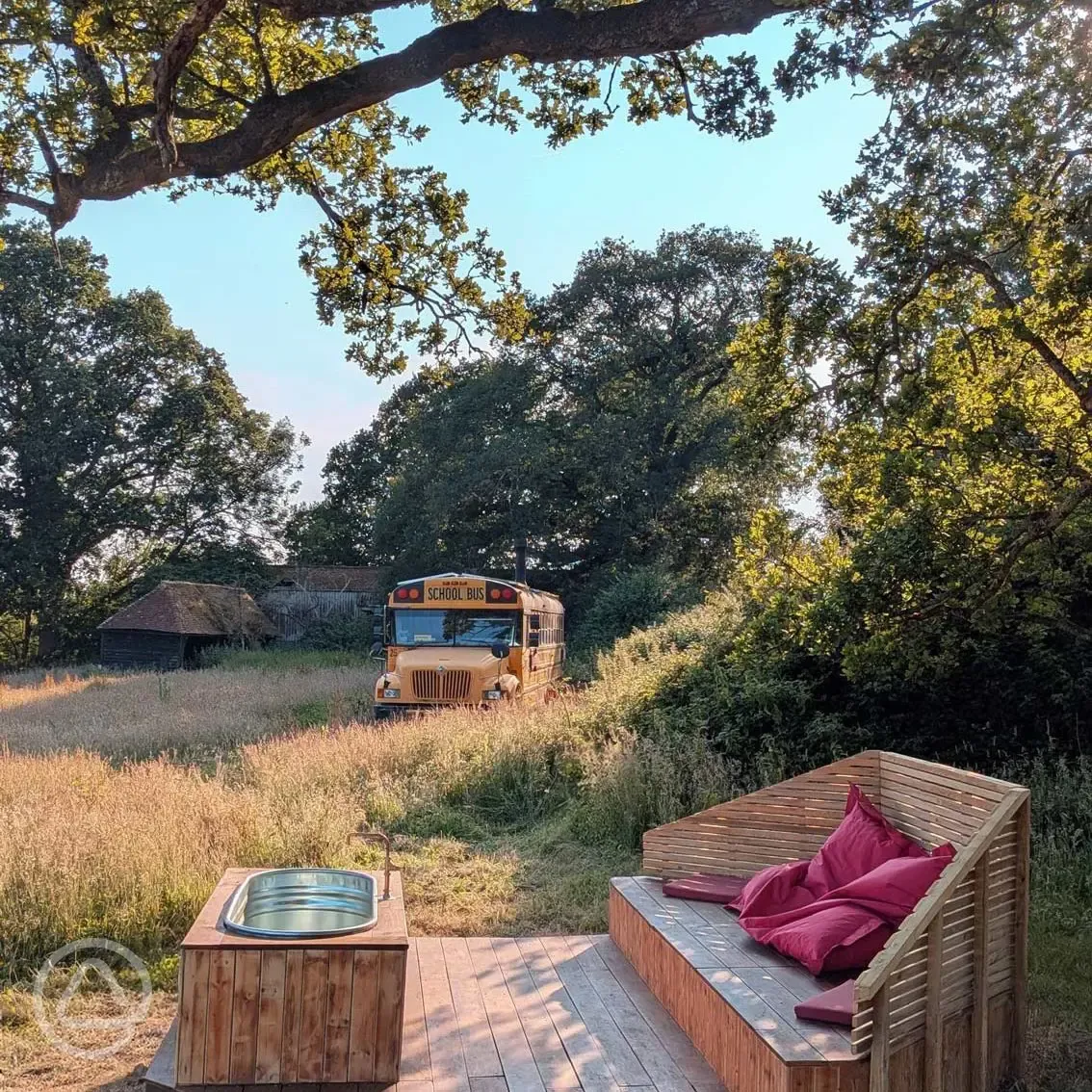 Glamping school bus with hot tub