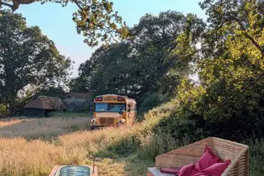 Glamping school bus with hot tub