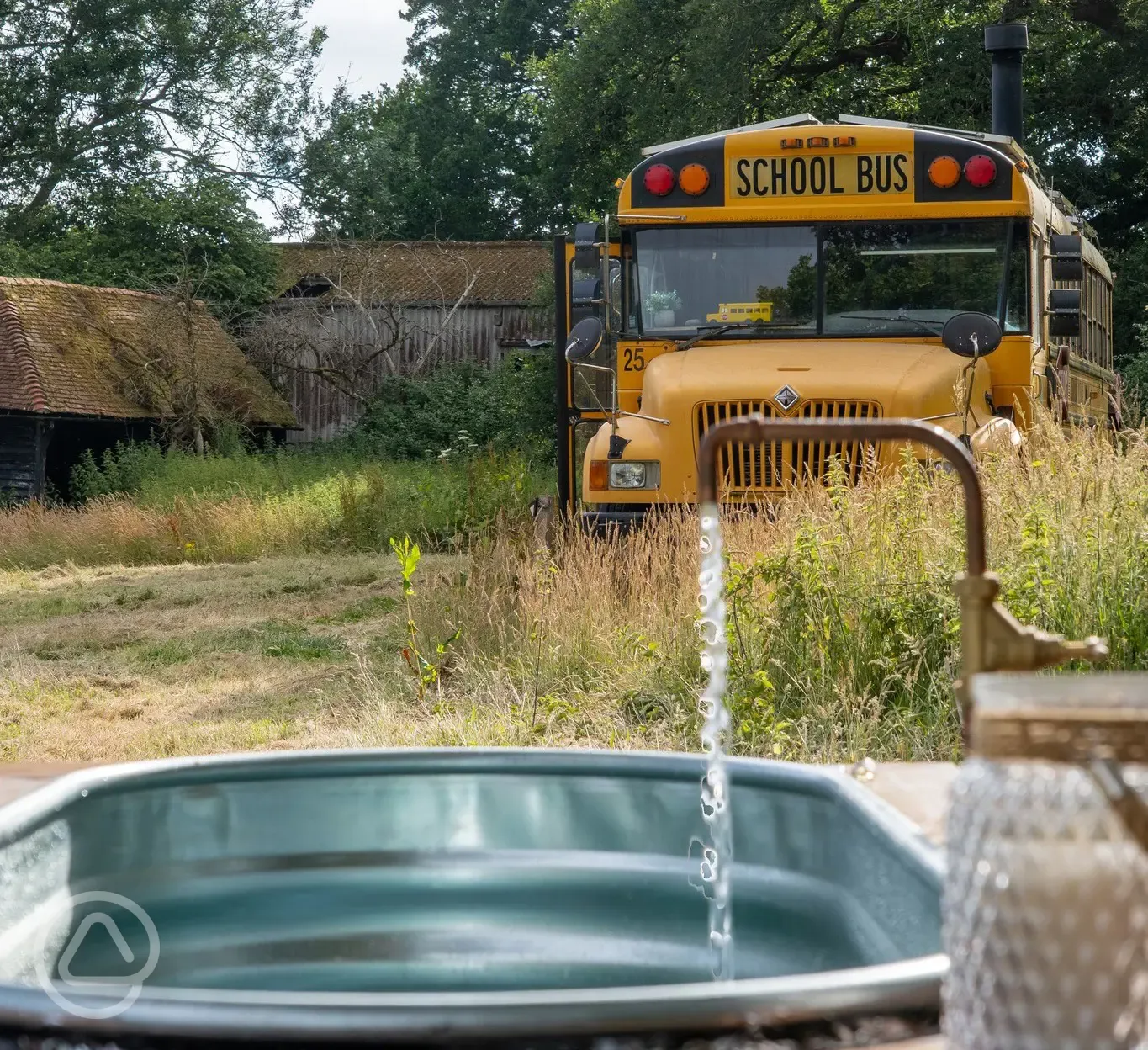 Glamping school bus with hot tub
