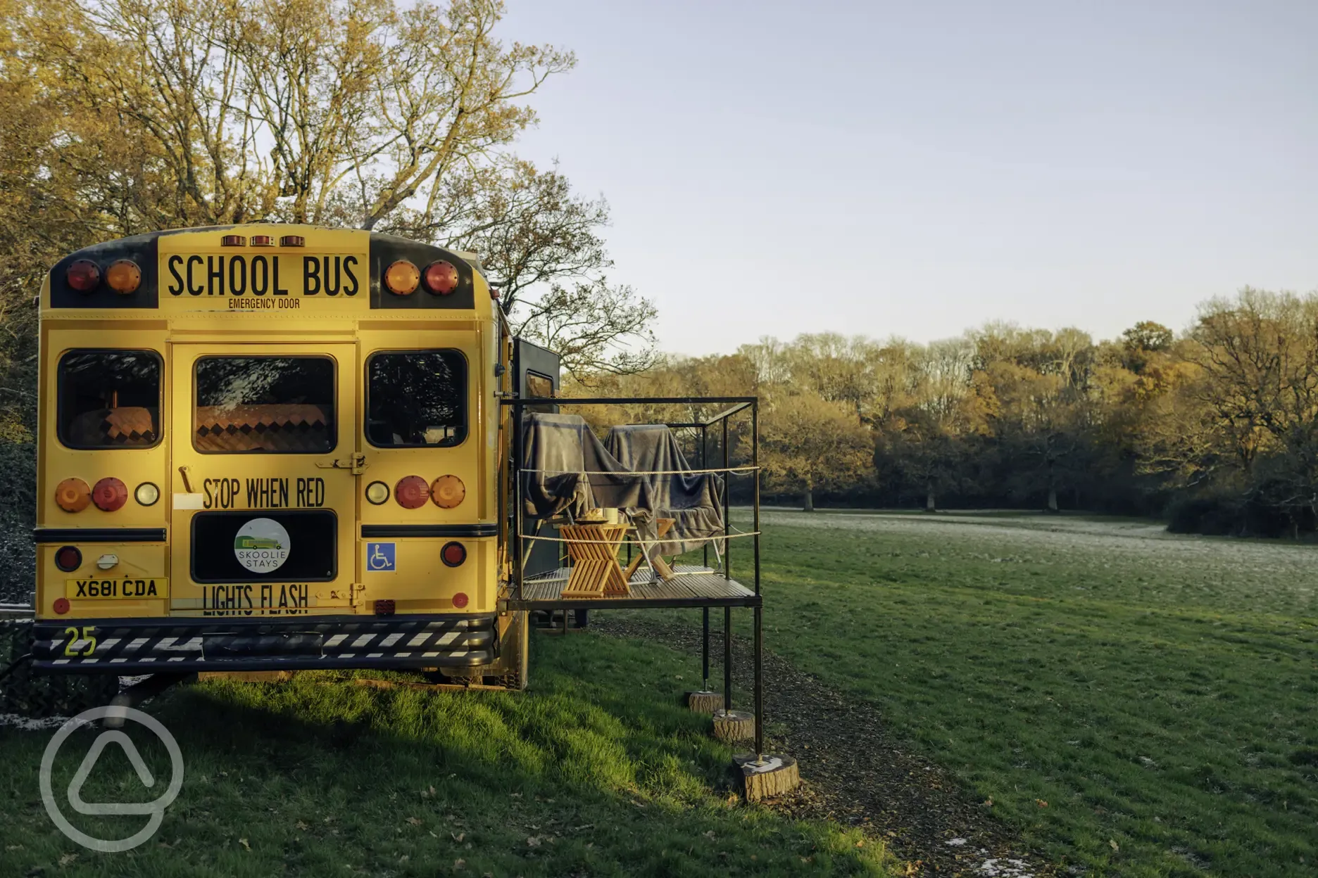 Glamping school bus and outdoor seating