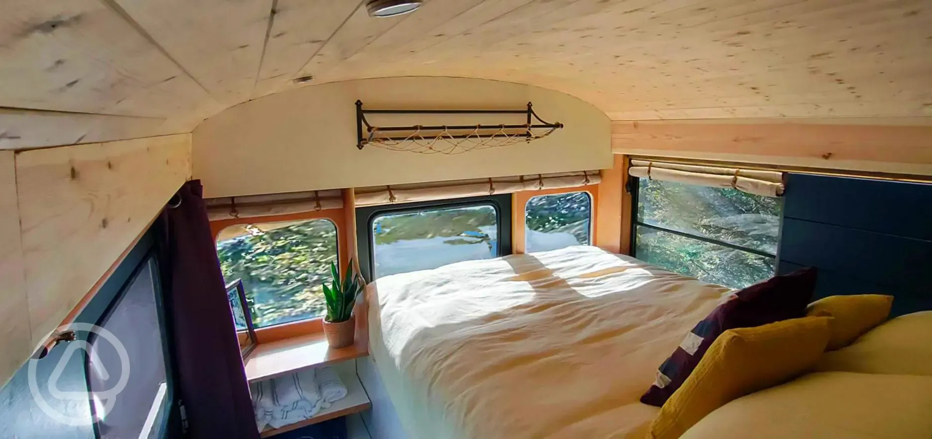 Glamping school bus king size bed