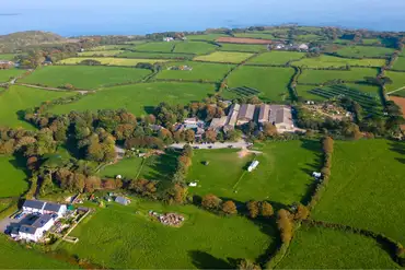 Aerial of Roskilly's Camping and the coast