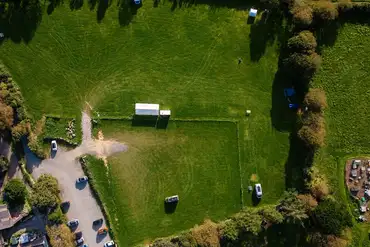 Aerial of Roskilly's Camping surrounded by trees