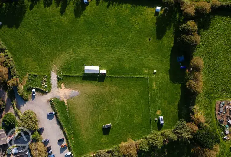 Aerial of Roskilly's Camping surrounded by trees