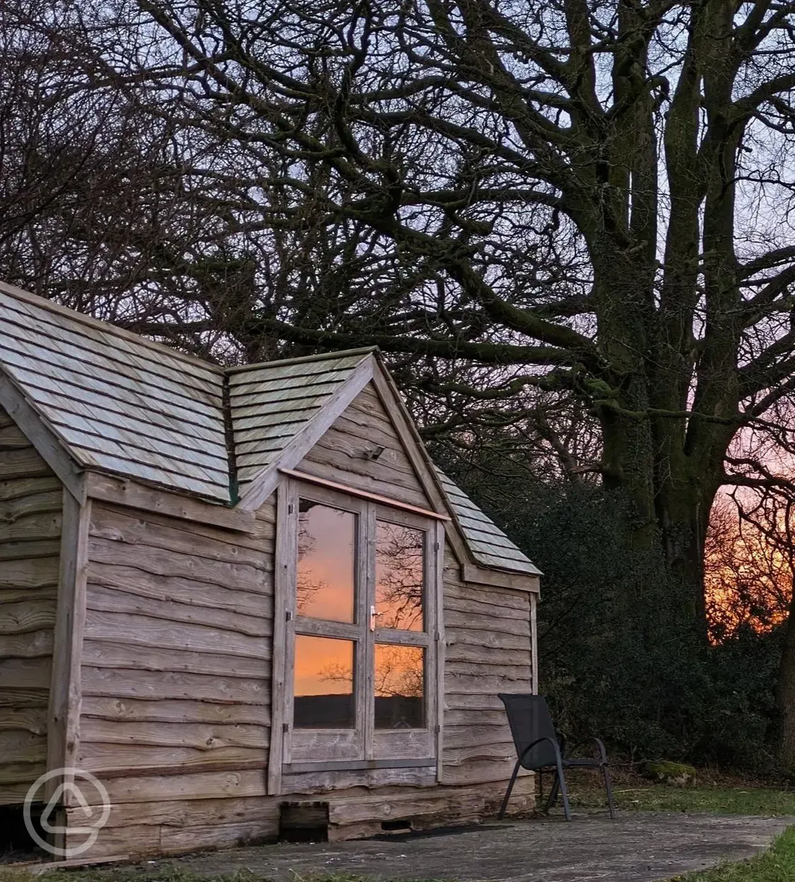 Log cabin at sunset