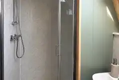 Ensuite in the glamping pods with a toilet, shower, and handwashing sink Ensuite in the glamping pods with a toilet, shower, and handwashing sink