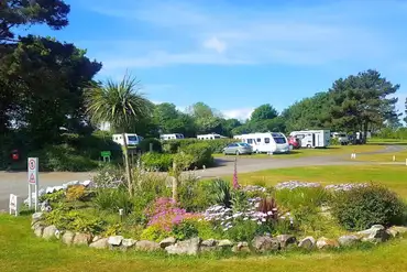 Grass touring pitches with landscaped grounds