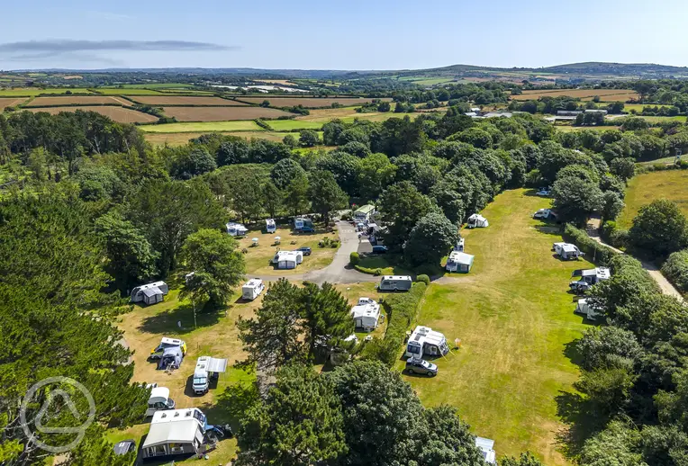 Aerial of Marazion Touring Park surrounded by trees for shade