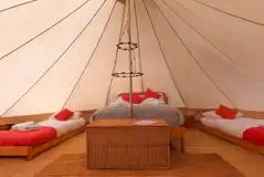 Bell tent with a double bed and two single beds Bell tent with a double bed and two single beds