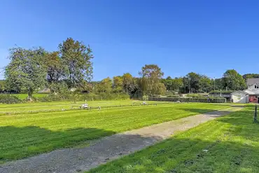 Electric grass pitches with a 16 amp electric hook up at The Rivers Edge