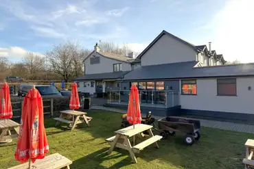 Onsite pub with a pub garden and benches