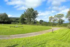 Spacious electric grass pitches with countryside views at The Rivers Edge