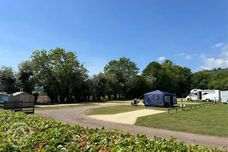Electric hardstanding pitches beside the grass pitches at The Rivers Edge