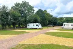 Electric hardstanding pitches beside the grass pitches at The Rivers Edge
