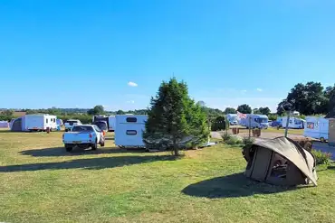 Electric grass tent pitches with 16 amp hook up (10m x 8m)