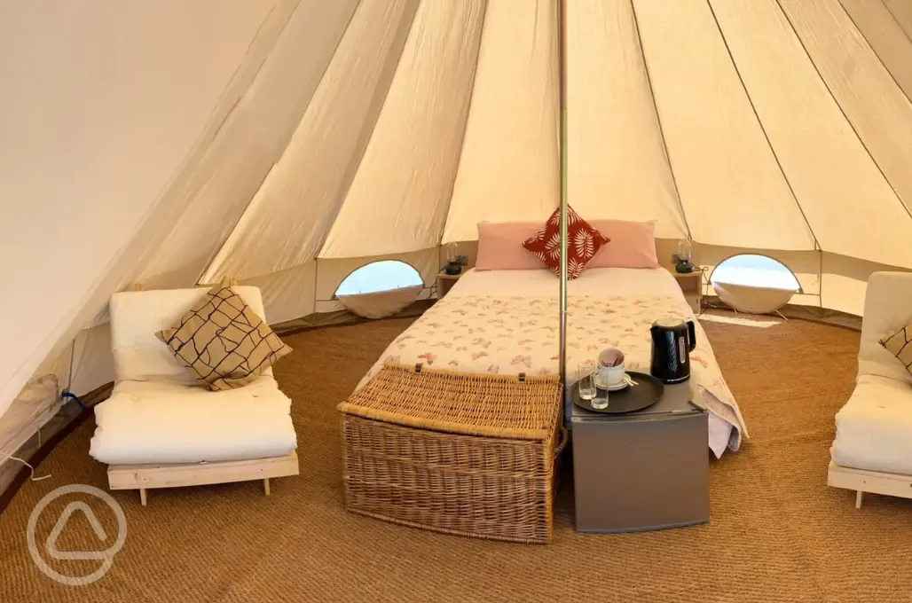 Bell tent king size bed and two futons (bedding provided))