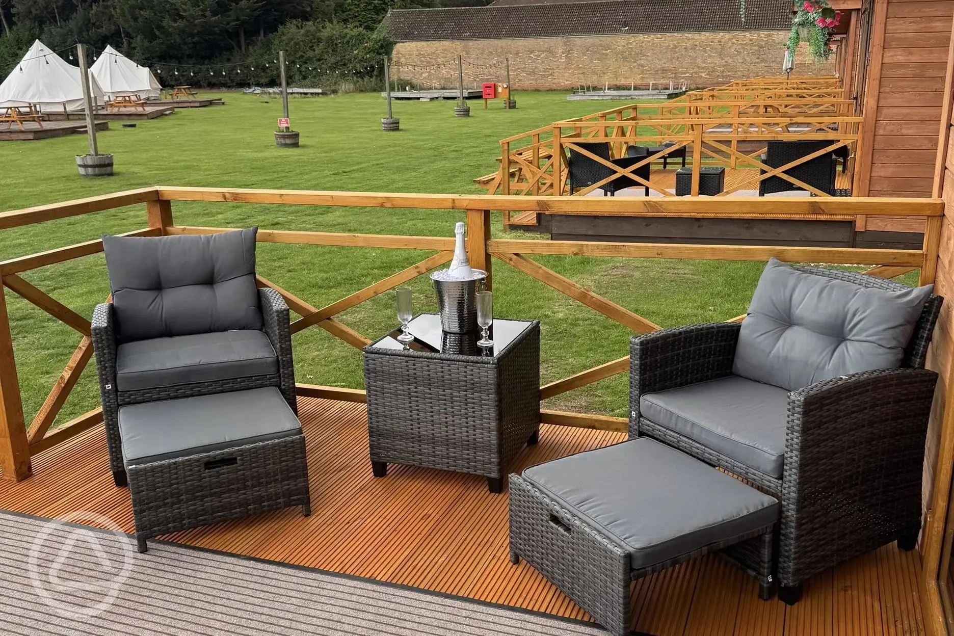 Glamping lodge decking with outdoor furniture