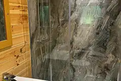 Glamping lodge ensuite bathrooms with a toilet and shower