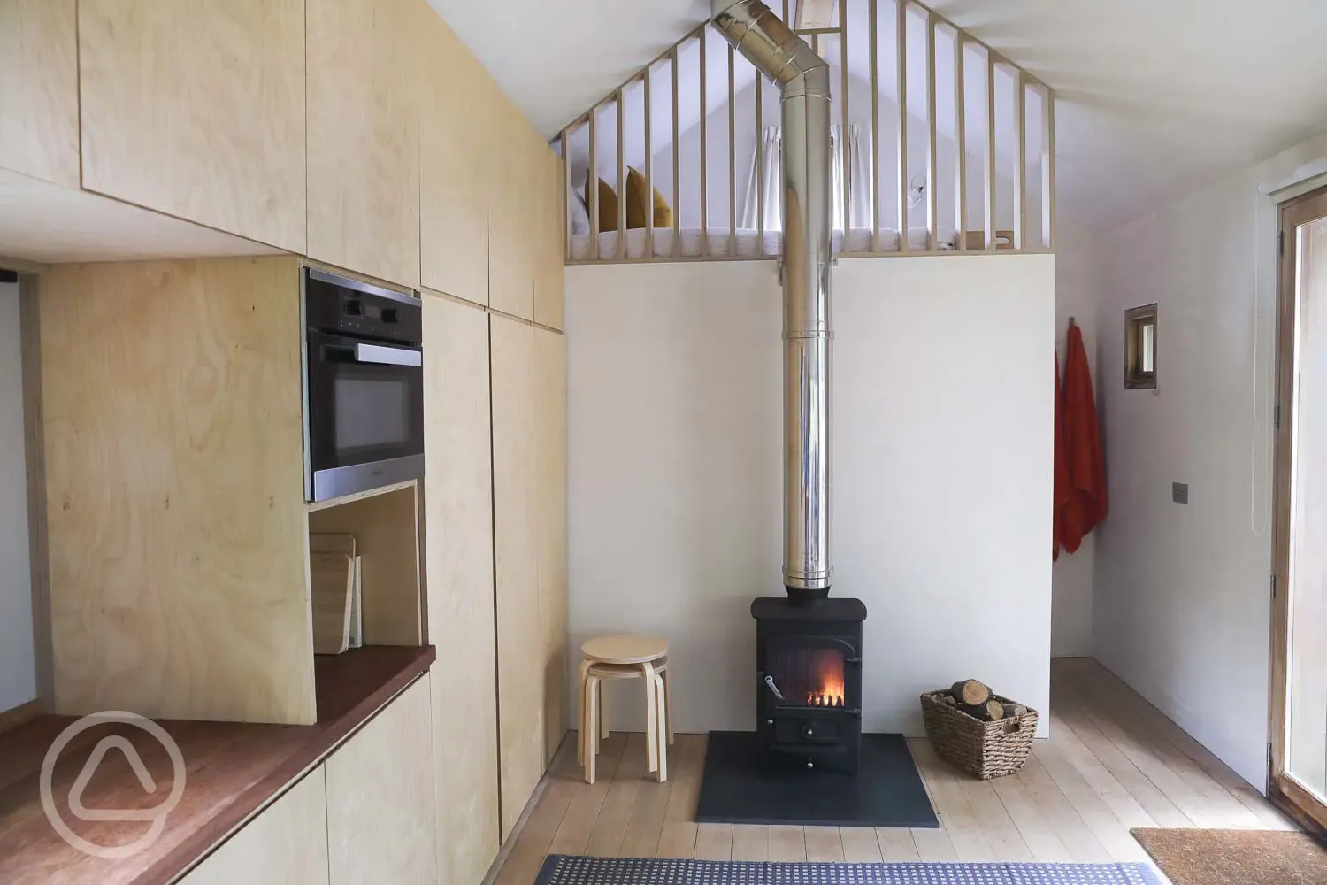 Log burner and stairs to the mezzanine 