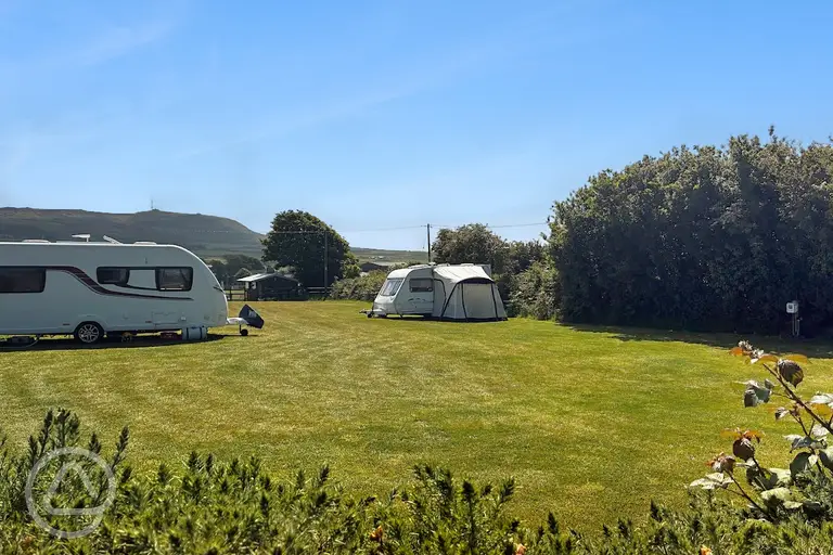 Fully serviced grass pitches with a 16 amp hook up 