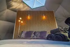 Glamping dome with king size bed and bedding