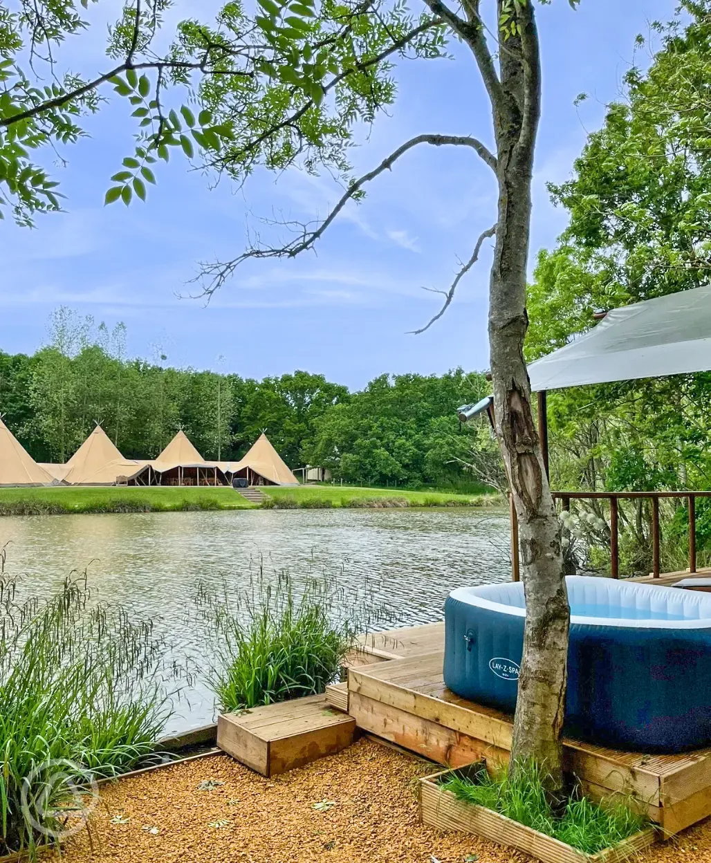 Teal safari tent overlooking the fishing lake