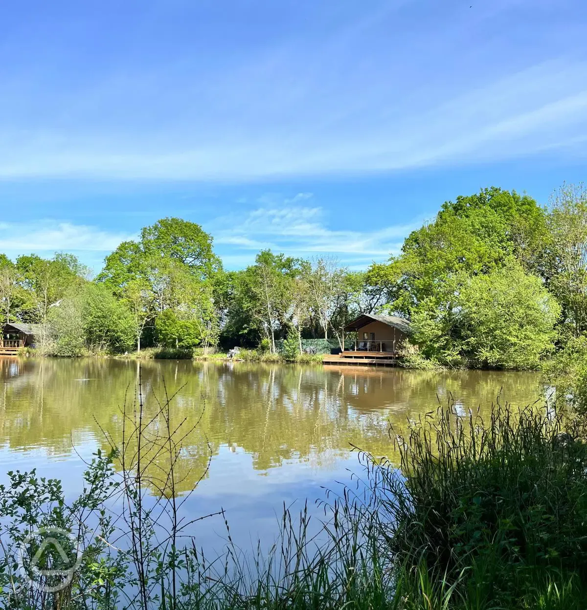 View across the lake of the safari tents