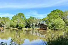 View across the lake of the safari tents