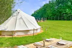 Bell tent with picnic bench