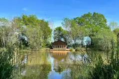 Teal safari tent across the lake