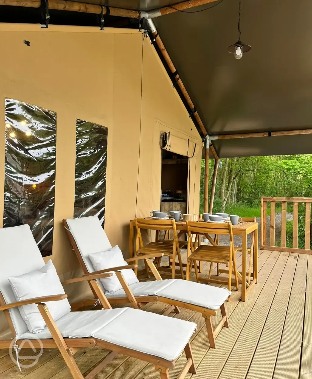 Kingfisher private decking with a dining table and loungers