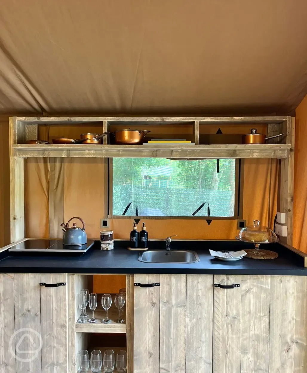 Teal safari tent kitchen area