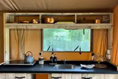 Teal safari tent kitchen area