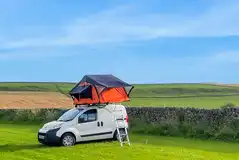 Non electric grass pitches with roof tents welcome