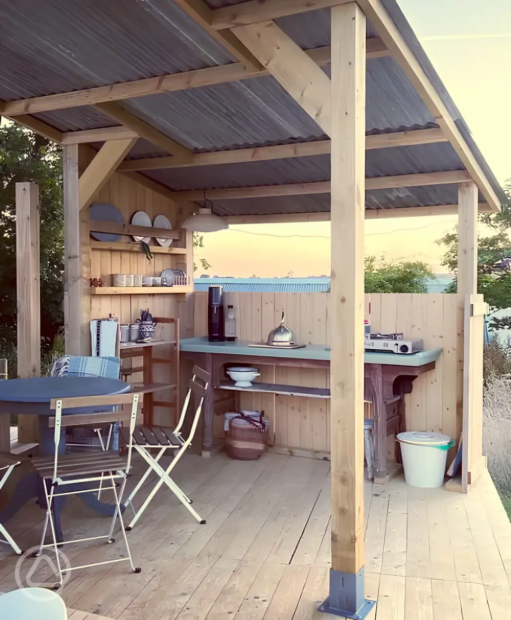 Kitchen area outside the bell tents on deckings