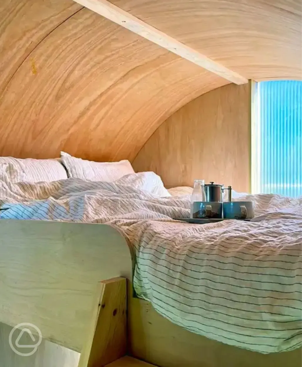 Wilderness hut raised king-sized bed