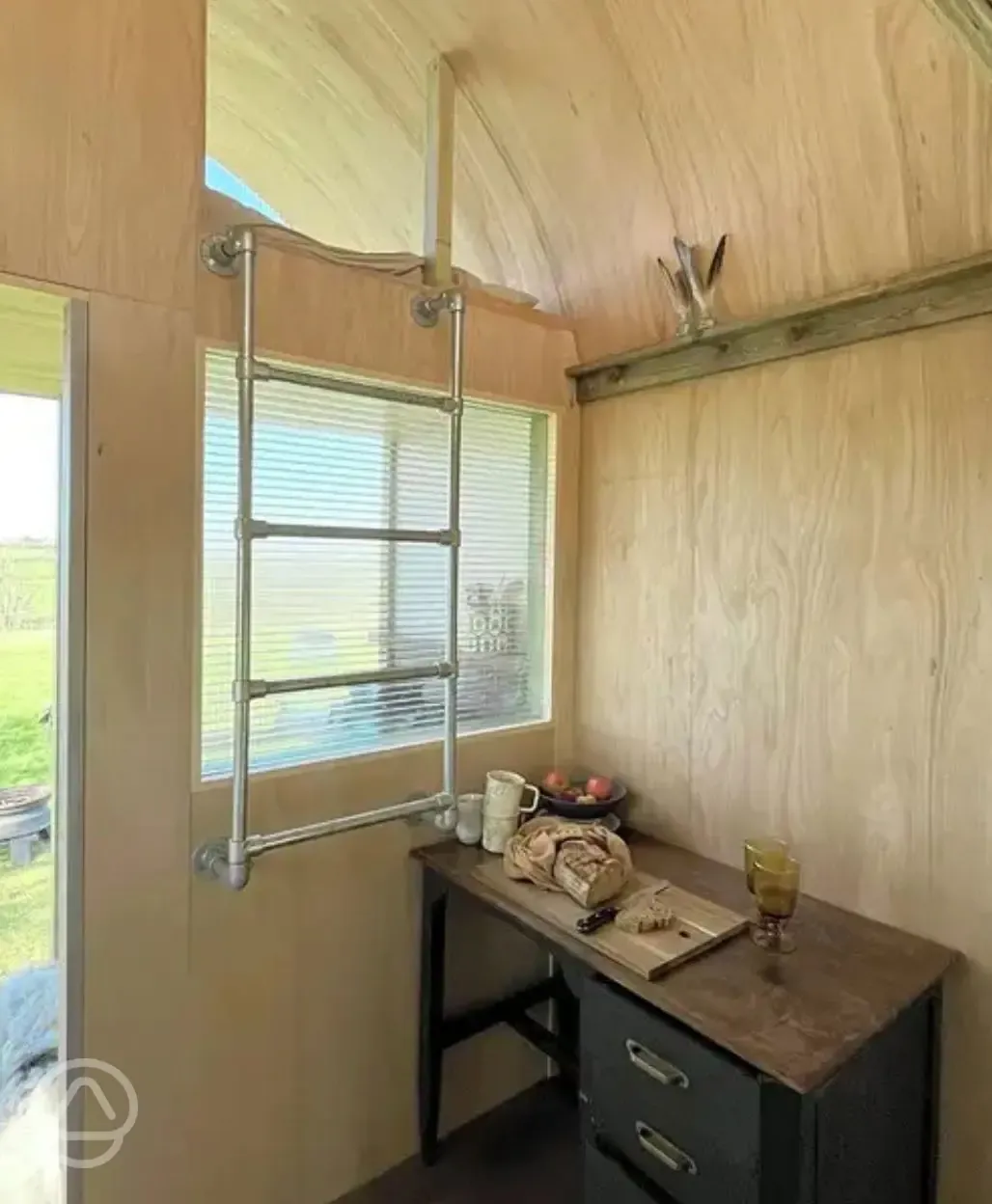 Wilderness hut raised single bed and desk