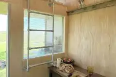 Wilderness hut raised single bed and desk Wilderness hut raised single bed and desk
