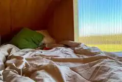 Wilderness hut raised king-sized bed Wilderness hut raised king-sized bed