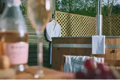 Botanist shepherd's hut outdoor area and hot tub