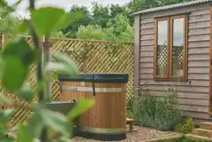 Heartwood shepherd's hut garden and hot tub