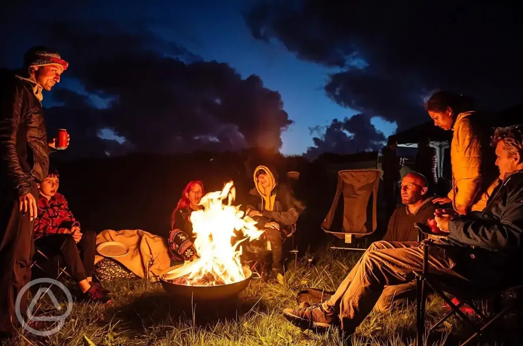 Campers sat around a campfire