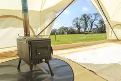 Wood burning stove in the bell tent